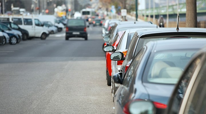 There are specific cars that were the most frequently stolen vehicles of 2016, as shown by cars lining both sides of a road