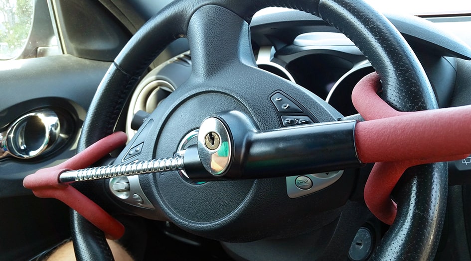 There are a few different ways you can save money on car insurance, including using a physical anti-theft device, like the one shown here