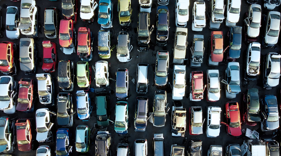 An aerial shot of many parked and damaged cars shows what can happen when your vehicle is a total loss