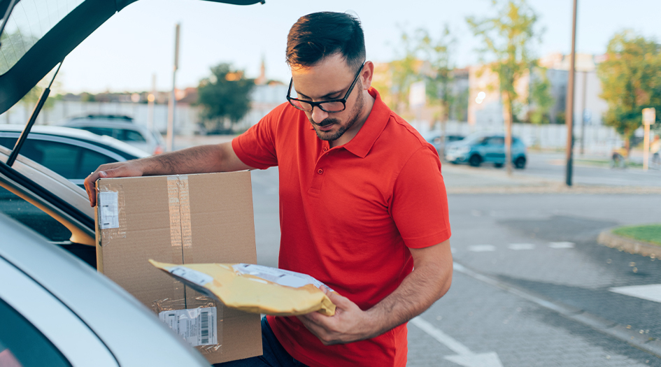 Here's a breakdown of whether you can use your personal vehicle for business, as shown by a man putting packages in his trunk