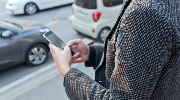 There is specific information that needs to be provided when making a car insurance claim, as shown by a man making a claim and typing on his mobile phone
