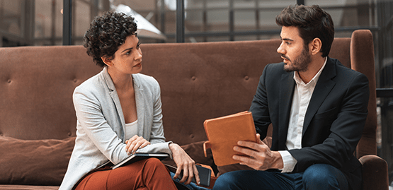 Three people sitting and having a conversation